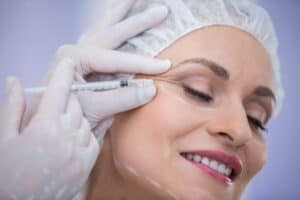 Woman receiving skin rejuvenation treatment for anti-aging in Albania.