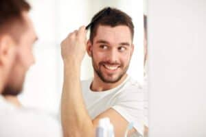 Image illustrating a man enjoying his new hair growth after a hair transplant.