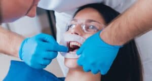 Dental patient receiving cosmetic treatment in clinic.