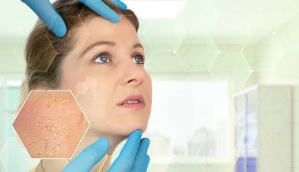 Woman examining skin quality for surgical results, highlighting age and lifestyle effects.