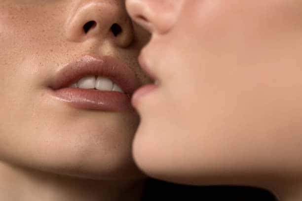 Close-up of two women showing lip lift and lip filler differences for cosmetic enhancement.