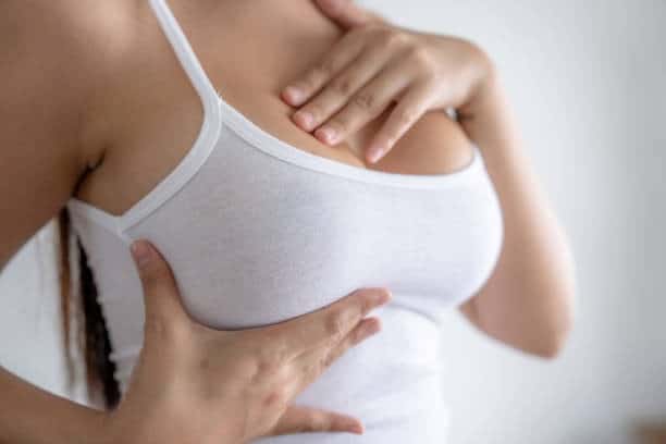 Woman performing breast augmentation with fat transfer in Albania, combining implants and fat grafti.